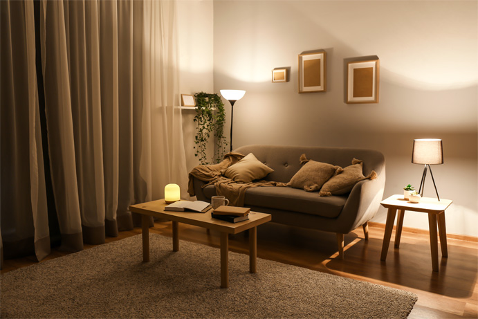 Living room in brown and beige colours in the evening with warm lighting