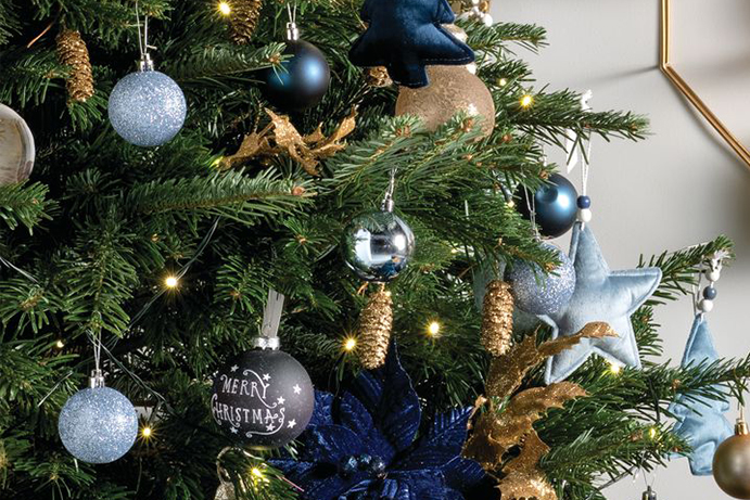 Close up of Christmas tree with blue and gold decorations