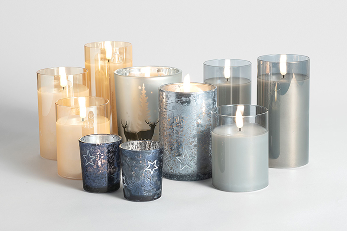 Selection of Christmas candles in blues, silvers and golds