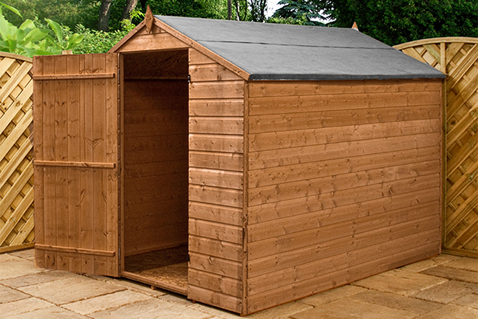 Timber pent roof shed with the door open on wooden decking