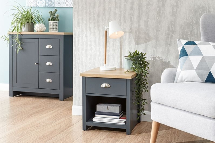 A side table and matching small sideboard in a dark blue colour with oak-effect tops and chrome handles