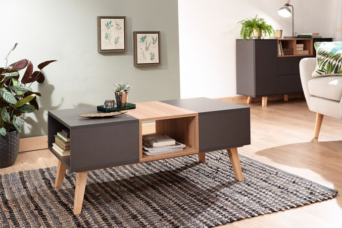 A modern coffee table in a blend of dark grey and oak-effect panelling