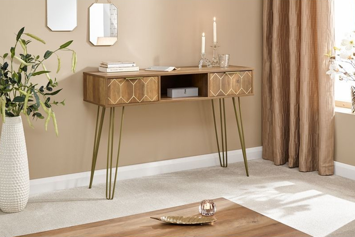 A vintage-inspired modern console table in a mango wood-effect style with gold detailing