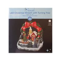 See more information about the Turning Tree Christmas Wreath Village Scene Decoration 8 LEDs